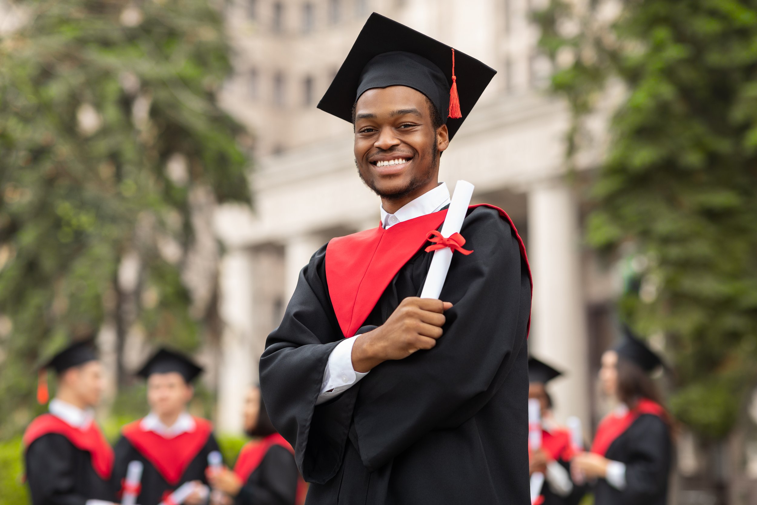 cheerful-african-american-guy-in-graduation-costum-2022-12-16-08-29-26-utc.jpg